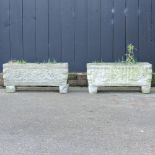 A pair of reconstituted stone garden planters,