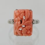 An 18 carat gold and coral ring,