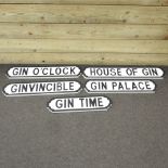 A collection of five painted wooden gin related road signs,