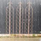A set of three folding garden lattice spires,
