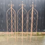 A set of three folding garden lattice spires,