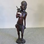 An African carved hardwood tribal figure,