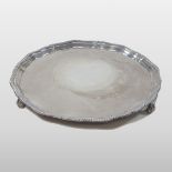 A modern silver salver, with gadrooned pie crust border, stamped 'Harrods London SW',