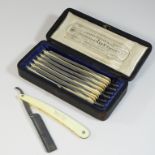 A set of 19th century ivory mounted steel 'George Butler Keen' razors,