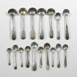 A collection of seventeen George III and later silver mustard and salt spoons,