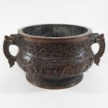 A large Chinese bronze censer, of circular form, relief decorated with figures and peony,