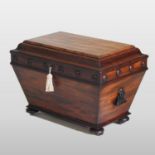 A William IV mahogany wine cooler, of sarcophagus shape, with a hinged lid and zinc lined interior,