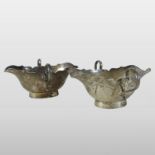 A pair of Edwardian Scottish silver double lipped sauce boats, each of boat shape,