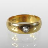 A 22 carat gold wedding band,