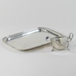 An early 20th century silver tray, of plain rectangular shape, with a reeded border,