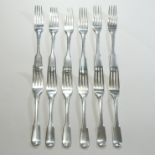 A set of nine George III silver fiddle pattern table forks, London 1819,