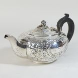 A George III silver teapot, of circular shape,