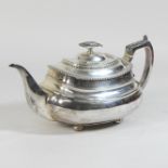 A George III silver teapot, of boat shape, the handle with acanthus leaf decoration,