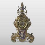 A Rococo style French champleve enamel and gilt metal mantel clock,