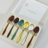 A harlequin set of six mid 20th century Norwegian silver gilt and enamelled coffee spoons,