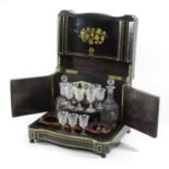 A 19th century rosewood, ebonised and cut inlaid decanter box,