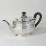 A Victorian silver teapot, of canted rectangular shape, with an ebonised handle and finial,