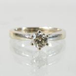 An 18 carat white gold diamond solitaire ring, approximately 0.