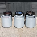 A set of three circular black garden pots, each 37cm diameter,