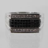 A 14 carat black diamond and white diamond gentleman's ring, approx 1.