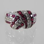 An 18 carat white gold ruby and diamond ring,