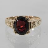 A 9 carat gold garnet ring,