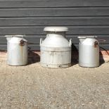 A milk churn, together with two others,