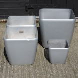 A set of four silver graduated garden pots,