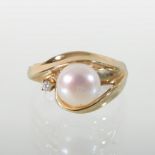 A 14 carat gold pearl and diamond ring