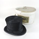 An early 20th century gentleman's top hat, boxed,