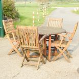 A hardwood drop leaf garden table, 123cm,