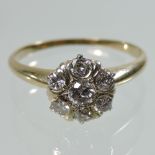 A 14 carat gold daisy set cluster ring,
