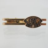 A gentleman's Caltex gold and gold plated enamel tie pin, 4.