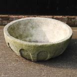 A large reconstituted stone planter,