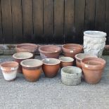 A collection of various garden plant pots,