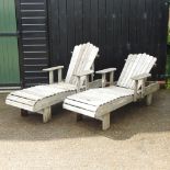 A pair of hardwood garden steamer chairs