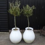 A pair of white glazed garden pots,