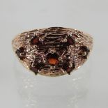 A 9 carat gold vintage ring, set with garnets,