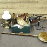 A shelf of brass and copper items, to include a set of copper saucepans,