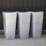 A set of three silver garden pots, each 90cm high, together with a set of three blue garden pots,