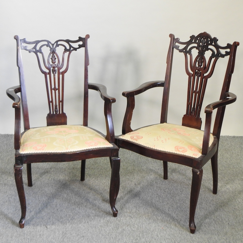 A pair of Edwardian open armchairs