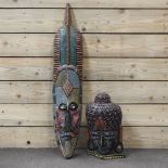 A wooden tribal mask, 97cm high,