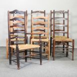 A set of four rush seated ladderback dining chairs,