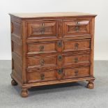 A 17th century style oak chest, with moulded drawers,