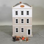 A painted wooden dolls house, 58cm,