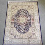 A Keshan style carpet, on a green ground,