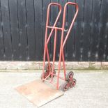 A red painted stair climbing sack barrow