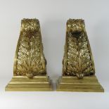 A pair of classical style gilt metal corbels, each with scrolled decoration,