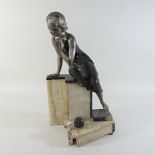An Art Deco silvered figure of a seated lady, on a marble base,