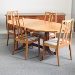 A 1970's Parker Knoll teak extending dining table, 175 x 92cm overall,